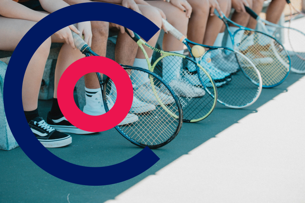 Kids with tennis rackets while sat on a bench with the Coordinate Sport logo in the foreground
