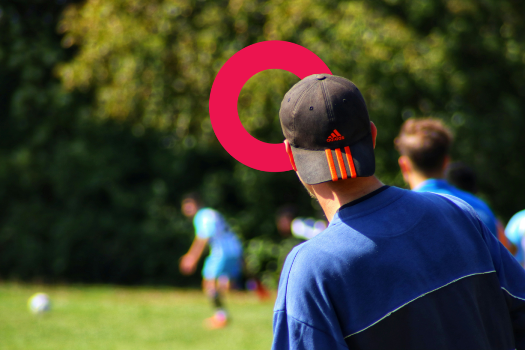 Football coaching with part of the Coordinate logo inthe background.